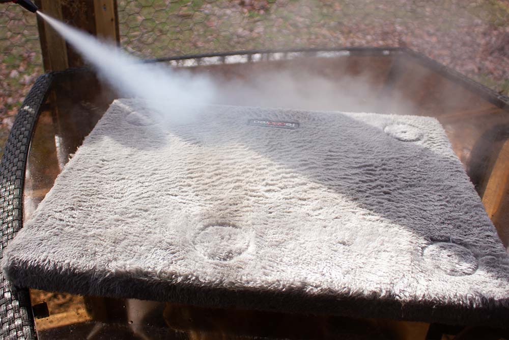 A small paper vacuum filter with cat hair and debris from cleaning a cat tree.